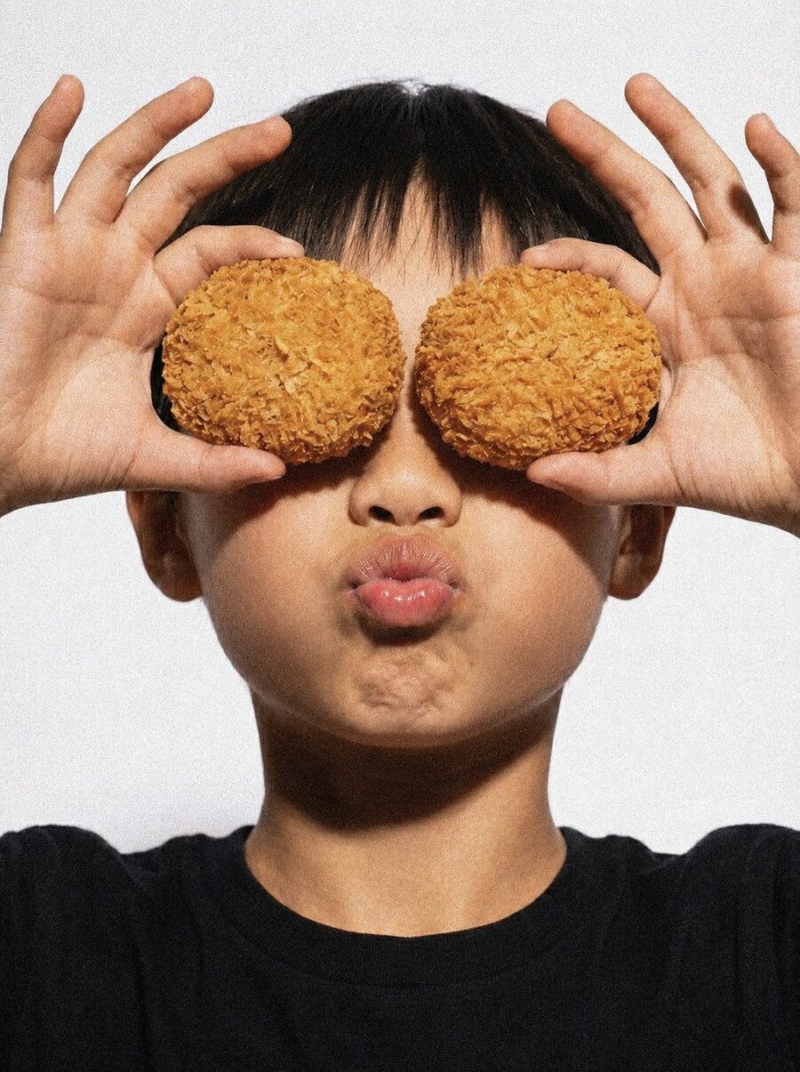 Kid holding Japanese korokke croquettes Riceful Berkeley